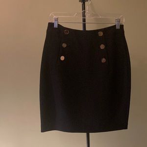Black skirt with brass buttons